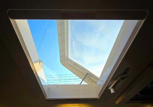 a skylight in the ceiling of a room at Caravan with Driving services in the surrounding area in Hwaseong