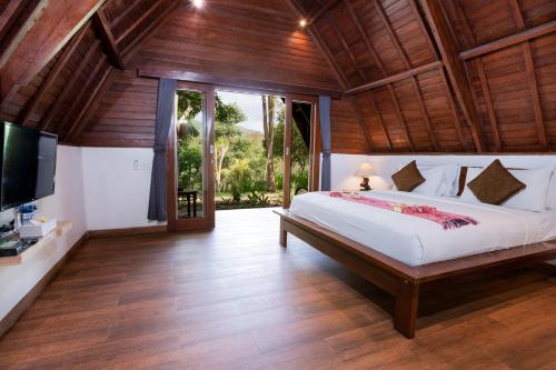 Katil atau katil-katil dalam bilik di Tahoma Villas Labuan Bajo by ABM