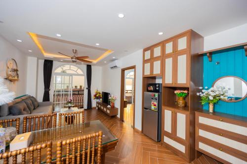 a living room with blue and white walls at Sun'House- Family 2BR Apt View Sea & Sunset Town Phu Quoc in Phu Quoc