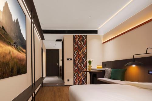 Postel nebo postele na pokoji v ubytování Mcsrh Hotel-Chongqing Jiefangbei Chaotianmen