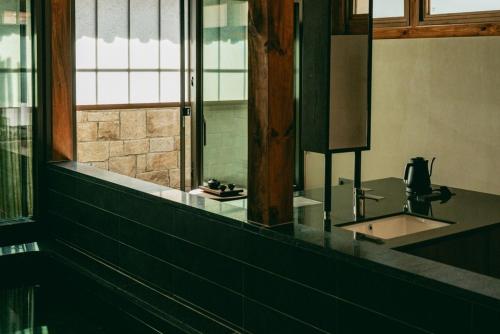 a bathroom with a sink and a mirror at Myeongjigak in Namwon