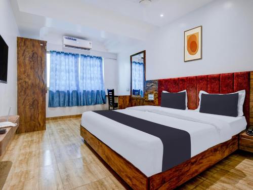 Postel nebo postele na pokoji v ubytování Super Townhouse Madgaon
