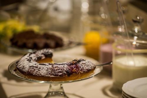 a chocolate donut on a plate on a table at Palazzo Guicciardini in Florence