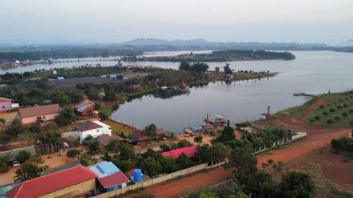 an aerial view of a town and a river at Cardamom Community Center in Moăt Preăh