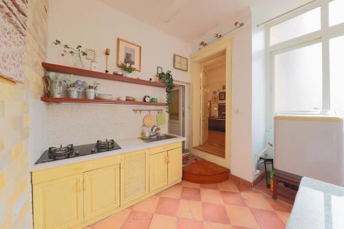 a kitchen with a sink and a counter top at Cozy Fun Homestay 12 in Hanoi
