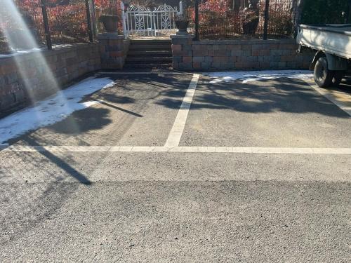 a parking lot with snow on the ground at Sarah's Small Garden in Cheonan