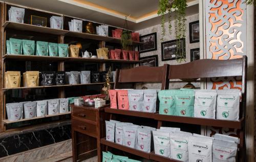 a store with a bunch of bags on a shelf at Mount Queens Hill Resort & Spa in Mirik