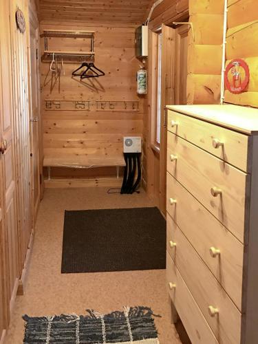 a room with a wooden cabin with a closet at Log Cabin Near Vasaloppet Ski Trail In Gopshus in Blyberg