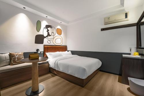 Postel nebo postele na pokoji v ubytování Mcsrh Hotel-Changsha Yuanjialing
