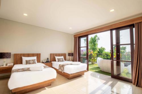 Katil atau katil-katil dalam bilik di The BALIem Villa