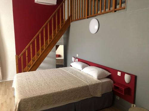 Postel nebo postele na pokoji v ubytování Hotel Aurelia