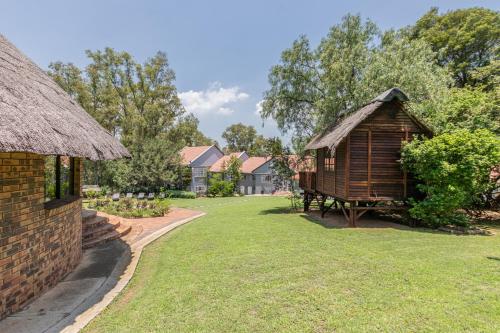 Κήπος έξω από το Grand Manor Self Catering Muldersdrift