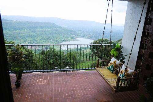 a balcony with a view of a river at Par-X - Villa Sukoon - 3BHK Valley View - Leave the World Far Behind in Satara