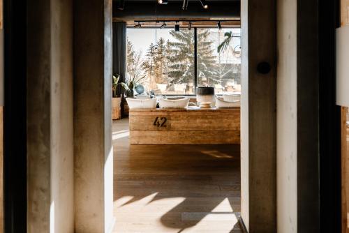 a bathroom with two sinks and a large window at THE HEARTS HOTEL - dein Boutique- und Event-Resort in Braunlage