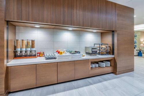 a kitchen with a counter in a building at Hilton Garden Inn Albuquerque Uptown in Albuquerque