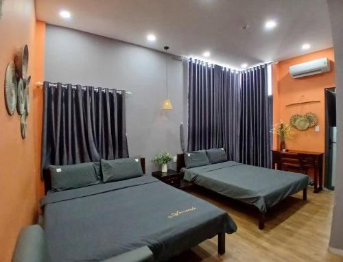 Een bed of bedden in een kamer bij Thanh Hằng Homestay