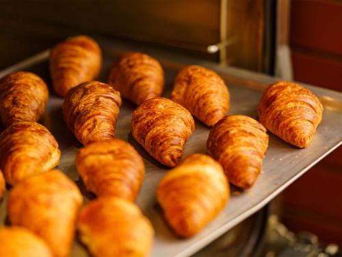 a bunch of croissants sitting on a tray at Mikazuki Sea-Park Hotel Katsuura in Katsuura