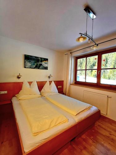 Postel nebo postele na pokoji v ubytování Biobauernhof Appartement Oberreith