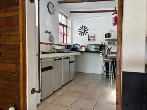 A cozinha ou kitchenette de Serenity Guesthouse