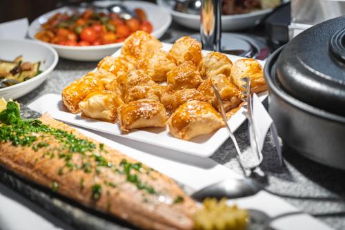 a plate of food with dumplings on a table at Baumhotel in Kopfing im Innkreis
