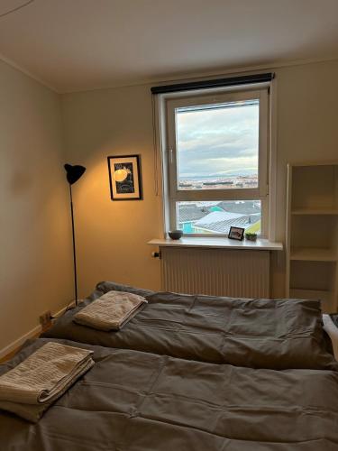 Postel nebo postele na pokoji v ubytování Illu Rental - Sea & City view Guesthouse