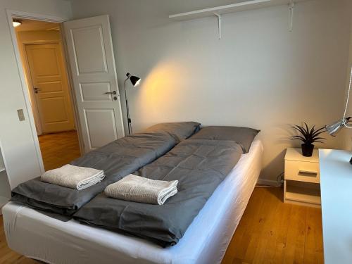 Postel nebo postele na pokoji v ubytování Illu Rental - Sea & City view Guesthouse