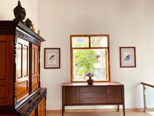 a living room with a dresser and a window at Star Light Tropical Villa in Bentota