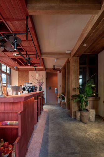a large room with a kitchen with a counter at The Pink Boutique Hotel in Da Lat