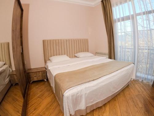 Ένα ή περισσότερα κρεβάτια σε δωμάτιο στο Gabala Buta Guest House
