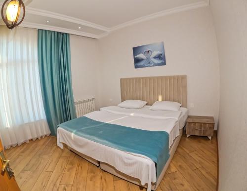 Ένα ή περισσότερα κρεβάτια σε δωμάτιο στο Gabala Buta Guest House