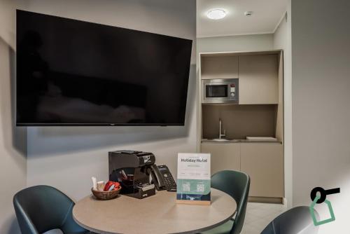 Cuisine ou kitchenette dans l'établissement HOTIDAY Apartment Collection - La Spezia