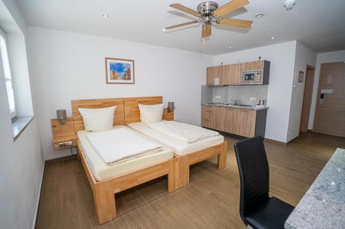 Postel nebo postele na pokoji v ubytování Boardinghouse Schellenberg