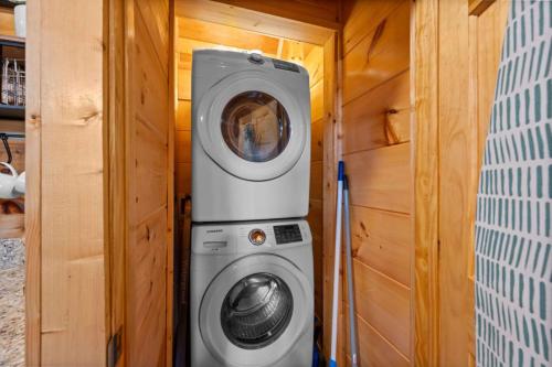 a washer and dryer in a tiny house at Heavenly Heights by Ghosal Luxury Lodging in Sevierville