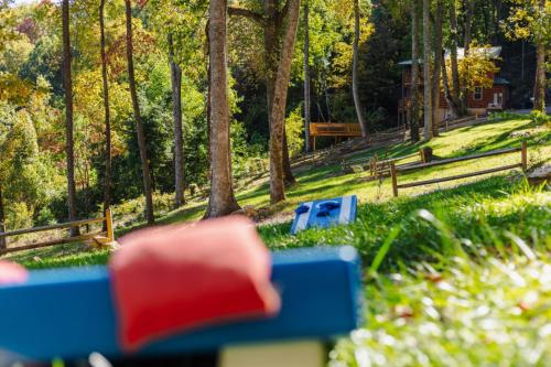 a park with blue benches in the grass at Heavenly Heights by Ghosal Luxury Lodging in Sevierville