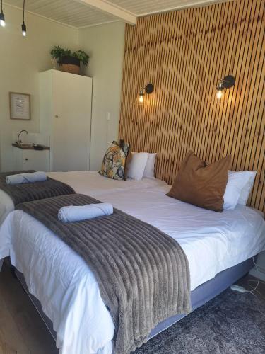 two large beds in a room with at Lavender Lane Queenstown in Queenstown