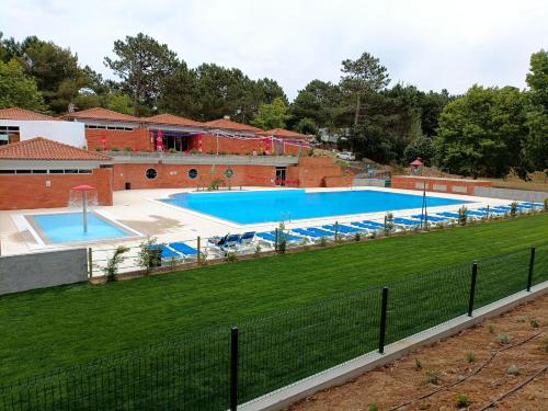 an overhead view of a large swimming pool at Parque de Campismo Orbitur Foz de Arelho. in Foz do Arelho