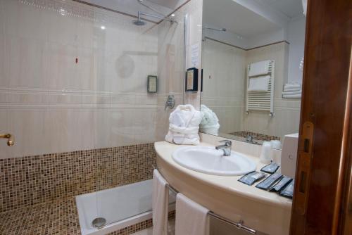 a bathroom with a sink and a shower at Hotel The Brand in Rome
