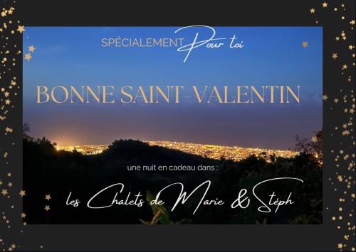 a sign with a picture of a city at night at Les Chalets de marie 2 - Vue mer, Jacuzzi SPA privatif dans le chalets Sans vis à vis in Saint-Denis