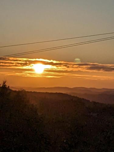a sunset from the top of a hill at Pura Vida Alentejo by Portus Alacer in Gavião