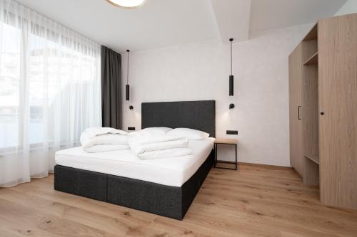Una cama o camas en una habitación de A CASA Infinity