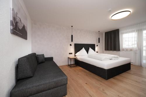 Una cama o camas en una habitación de A CASA Infinity