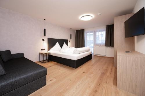 Una cama o camas en una habitación de A CASA Infinity