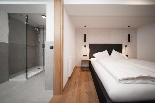 Una cama o camas en una habitación de A CASA Infinity