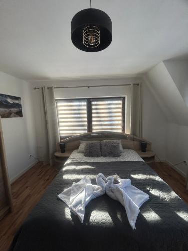 Ένα ή περισσότερα κρεβάτια σε δωμάτιο στο Apartament Hey Gron