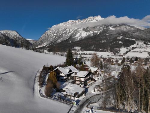 an aerial view of a house in the snow at Landhaus St. Georg in Gröbming