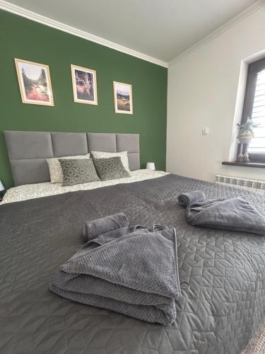 Ένα ή περισσότερα κρεβάτια σε δωμάτιο στο Apartament Hey Gron