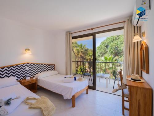 Ένα ή περισσότερα κρεβάτια σε δωμάτιο στο Apartamentos BELLA MARÍA