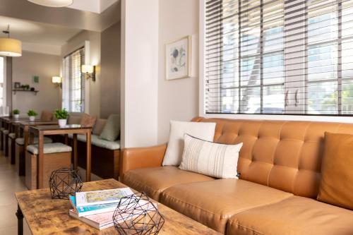 a living room with a couch and a table at Riviere South Beach Hotel in Miami Beach