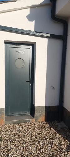 a door on the side of a building at Casa Rural La Yesería Alcocer in Sacedón