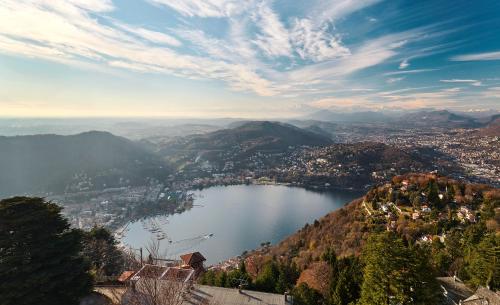 a view of a city and a lake at Nuvole Garden Hotel in Brunate